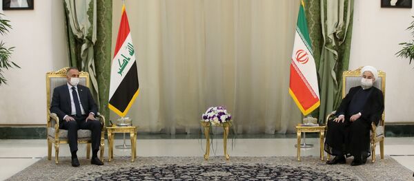 الرئيس الإيراني حسن روحاني ورئيس الوزراء العراقي مصطفى الكاظمي - سبوتنيك عربي