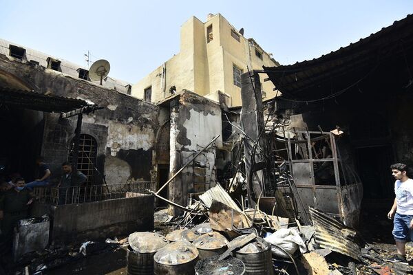  بالصور... آثار حريق سوق البزورية الشهير بدمشق القديمة - سبوتنيك عربي