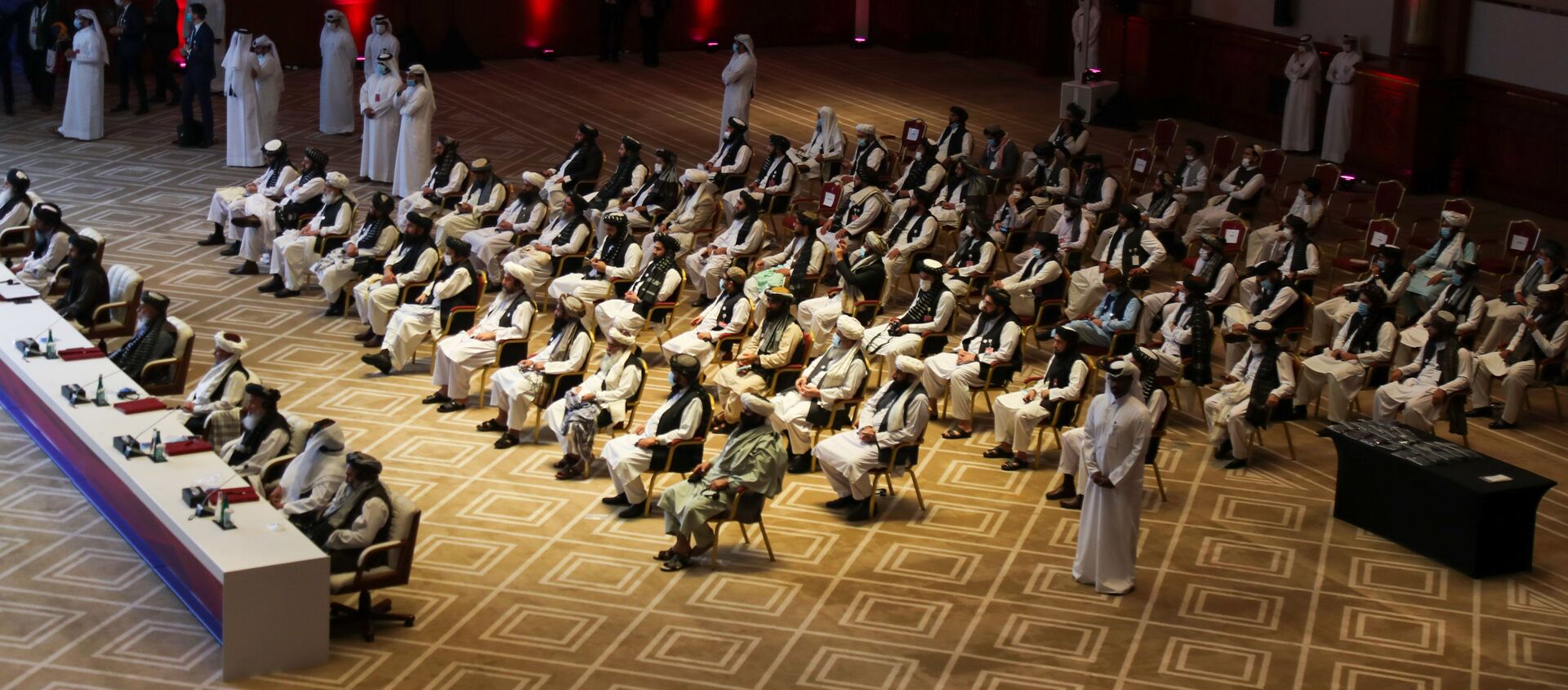الجلسة الافتتاحية لمفاوضات السلام بين الحكومة الأفغانية وحركة طالبان، المنعقدة في الدوحة، قطر 12سبتمبر 2020 - سبوتنيك عربي, 1920, 19.06.2021