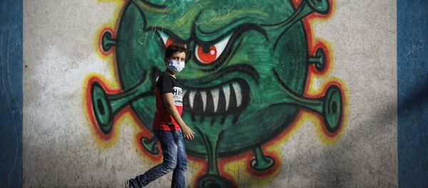 رسم غرافيتي توضيحي للوضع الوبائي في العالم ، فيروس كورونا - غزة، قطاع غزة، فلسطين 22 سبتمبر 2020 - سبوتنيك عربي