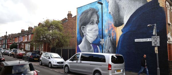 رسم غرافيتي توضيحي للوضع الوبائي في العالم ، فيروس كورونا - لندن، بريطانيا 15 أكتوبر 2020 - سبوتنيك عربي