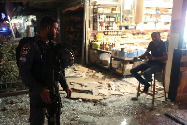 تداعيات قصف المقاومة الفلسطينية على حي حولون، مدينة تل أبيب، إسرائيل، 11-12 مايو 2021 - سبوتنيك عربي