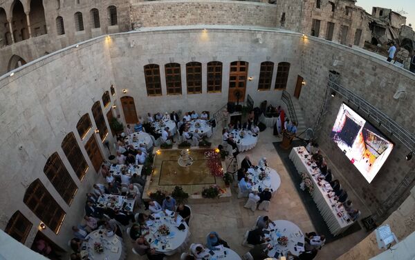 فعاليات خارطة لترميم المول في ساحة مدرسة سيف الدولة الحمداني في حلب القديمة، سوريا 30 يونيو 2021 - سبوتنيك عربي