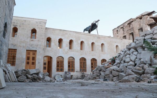 فعاليات خارطة لترميم المول في ساحة مدرسة سيف الدولة الحمداني في حلب القديمة، سوريا 30 يونيو 2021 - سبوتنيك عربي