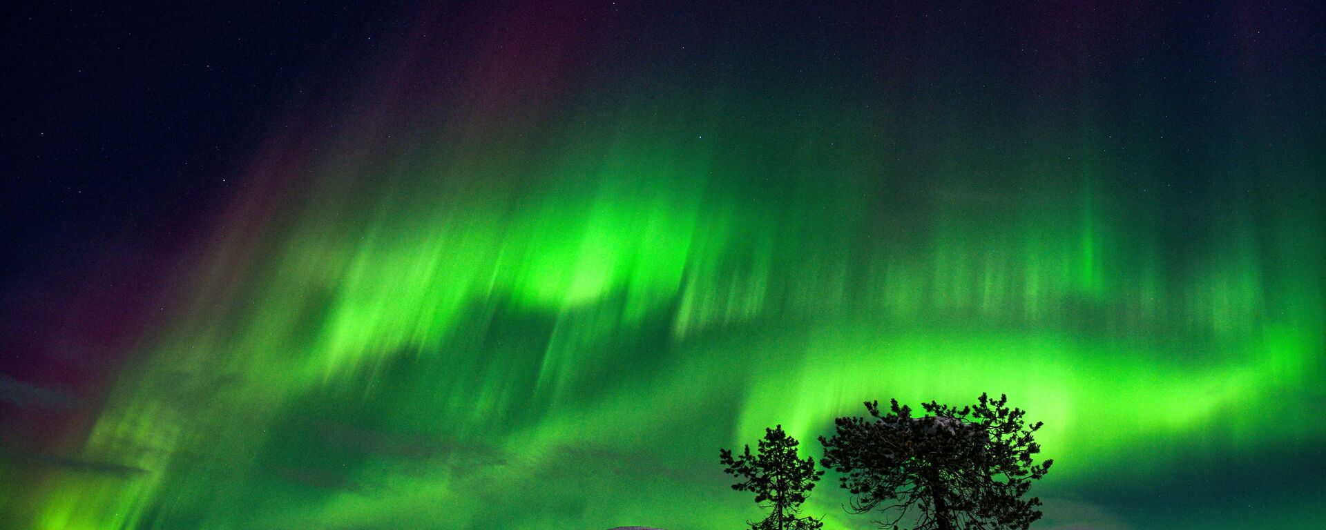 الشفق القطبي، والمعروف أيضا باسم أضواء الشمال، يضيء سماء الليل في كولاري، لابلاند، فنلندا، 15 يناير 2022. - سبوتنيك عربي, 1920, 17.01.2022