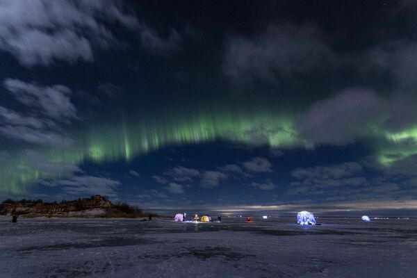 الشفق القطبي، والمعروف أيضا باسم أضواء الشمال، يضيء سماء الليل في خليج فنلندا، سان بطرسبورغ، روسيا، 15 يناير 2022. - سبوتنيك عربي