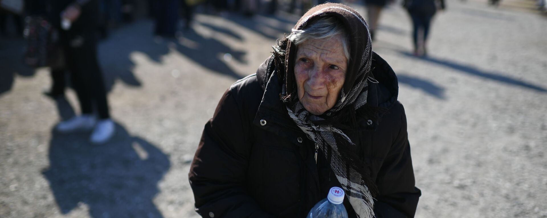 لاجئون من ماريوبول في قرية بيزيمينويه في منطقة دونيتسك، أوكرانيا، حدود روسيا 24 مارس 2022 - سبوتنيك عربي, 1920, 19.04.2022
