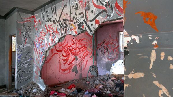 فنان فلسطيني يرسم لوحات فنية داخل المباني المدمرة بفعل الغارات الإسرائيلية على قطاع غزة
 - سبوتنيك عربي