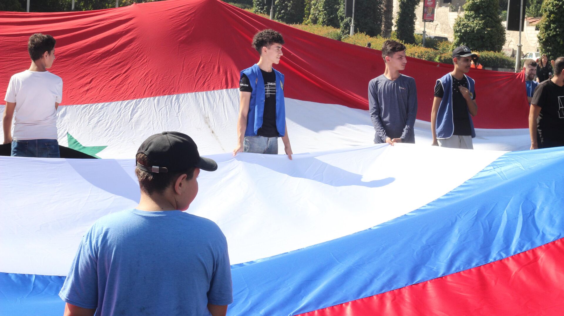 الجالية الروسية تحتفل بـ عيد العلم في ساحة الأمويين بدمشق - سبوتنيك عربي, 1920, 22.08.2023