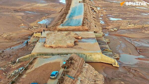 لقطات لـسبوتنيك توثق الأضرار الجسيمة التي لحقت بقرية المخيلي جنوبي مدينة درنة الليبية جراء الفيضانات - سبوتنيك عربي
