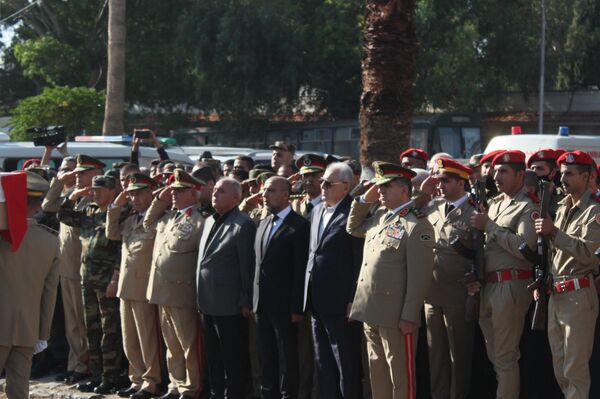 تشييع ضحايا الهجوم الإرهابي على حفل تخريج &quot;الكلية الحربية&quot; في محافظة حمص - سبوتنيك عربي