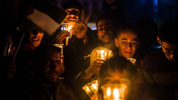 متضامنون يضيئون أسماء ضحايا غزة على جدران قلعه دمشق - سبوتنيك عربي