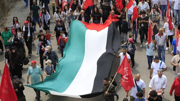 مسيرة عيد العمال في بيروت: تضامن مع فلسطين ومطالب اقتصادية ووطنية - سبوتنيك عربي