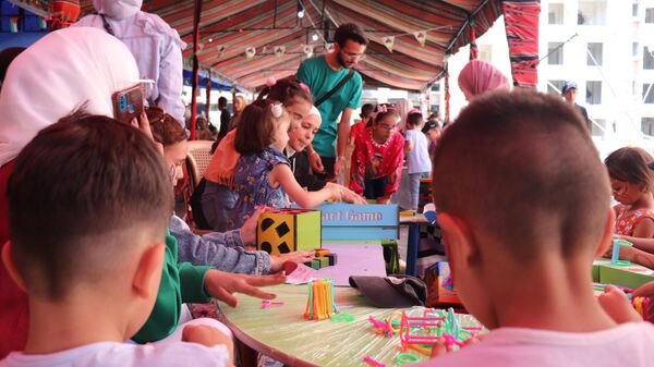 جدران (مخيم اليرموك) بدمشق تردد صدى ضحكات أطفاله ابتهاجا بالعيد - سبوتنيك عربي