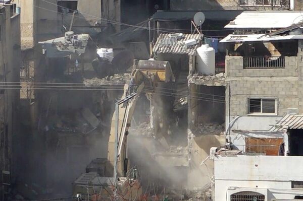 صورلعشرات المنازل والمحال التجارية المدمرة بمخيم طولكرم شمال الضفة الغربية صورلعشرات المنازل والمحال التجارية المدمرة بمخيم طولكرم شمال الضفة الغربية - سبوتنيك عربي