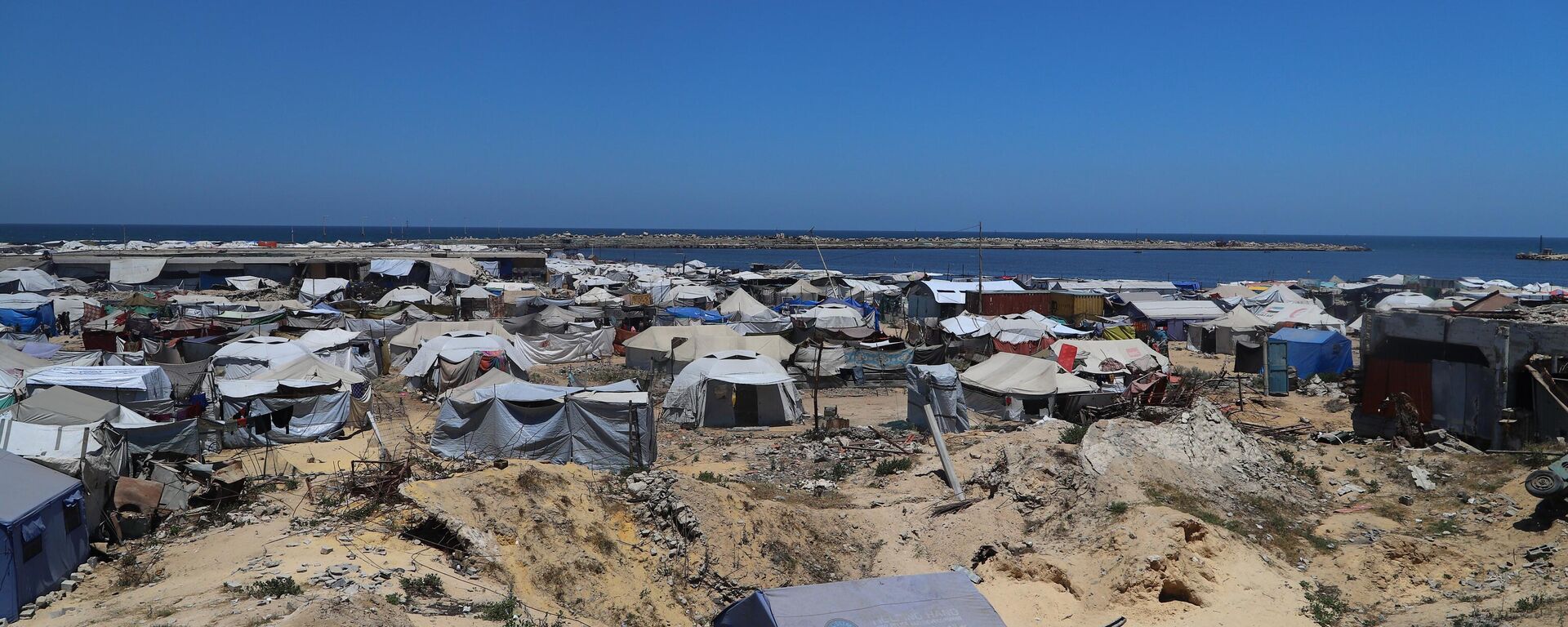 ميناء غزة يتحول من مكان للفرح والترفيه إلى ملاذ للنازحين الفارين من الموت - سبوتنيك عربي, 1920, 05.07.2025