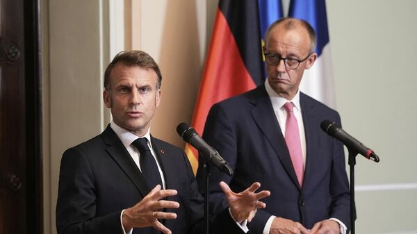 المستشار الألماني، فريدريتش ميرتس، والرئيس الفرنسي، إيمانويل ماكرون - سبوتنيك عربي