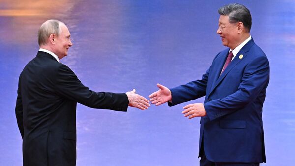 الرئيس الروسي فلاديمير بوتين، ورئيس جمهورية الصين الشعبية شي جين بينغ - سبوتنيك عربي