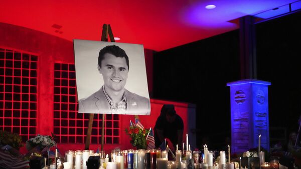 A photo of Charlie Kirk, the CEO and co-founder of Turning Point USA who was shot and killed, stands at his vigil - سبوتنيك عربي