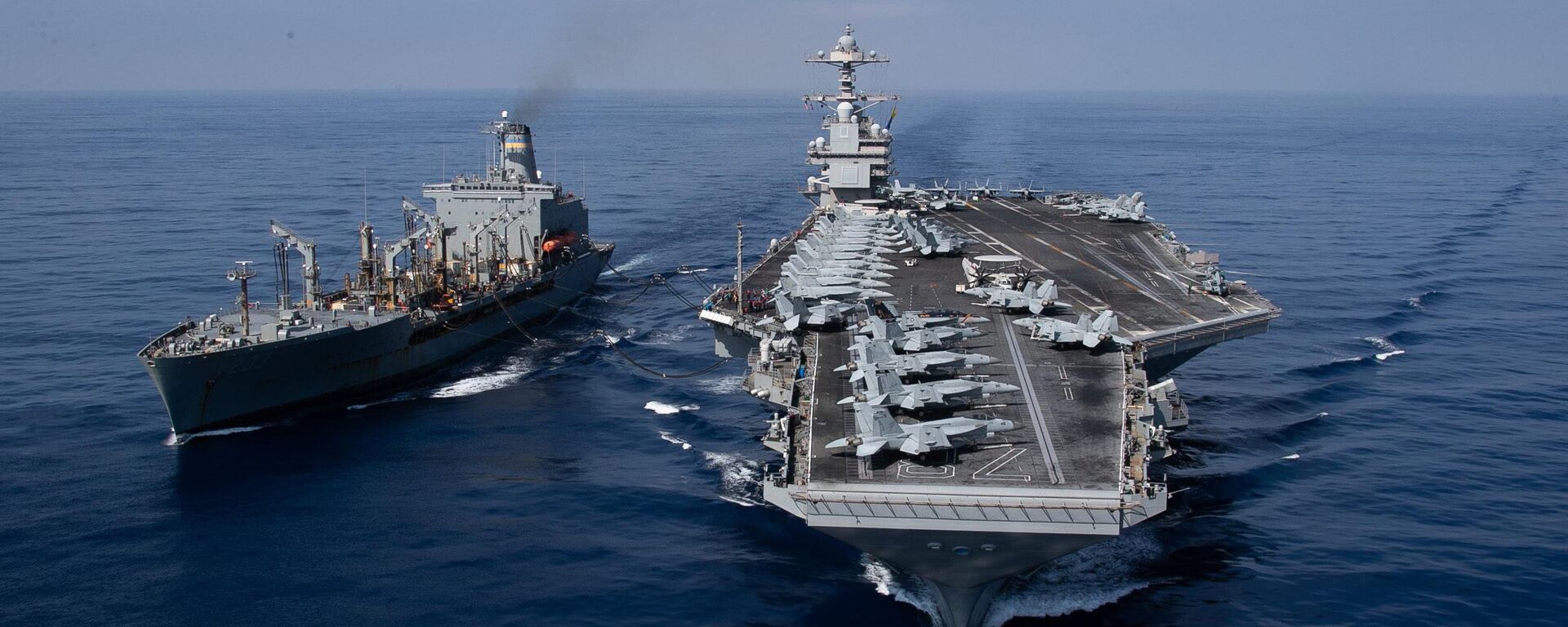 The world's largest aircraft carrier USS Gerald R. Ford (CVN) 78 and the USNS Laramie (T-AO-203) conduct a refueling-at-sea in the Eastern Mediterranean Sea, Oct. 11, 2023. - سبوتنيك عربي, 1920, 31.12.2025