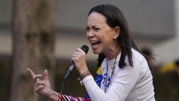 Opposition leader Maria Corina Machado addresses supporters during a protest against President Nicolas Maduro the day before his inauguration for a third term in Caracas, Venezuela, Thursday, Jan. 9, 2025. (AP Photo/Matias Delacroix) - سبوتنيك عربي