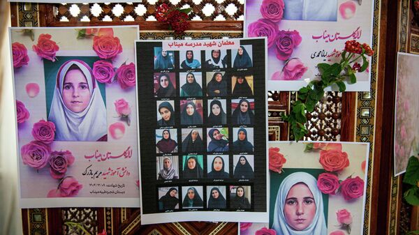 Portraits of school children from the Shajarah Tayyebeh Elementary School in Minab, who were killed in a U.S strike are displayed during a press conference by Iranian Ambassador to Tunisia Massoud Hosseinian, in Tunis, Tunisia, Thursday, March 12, 2026. (AP Photo/Ons Abid) - سبوتنيك عربي