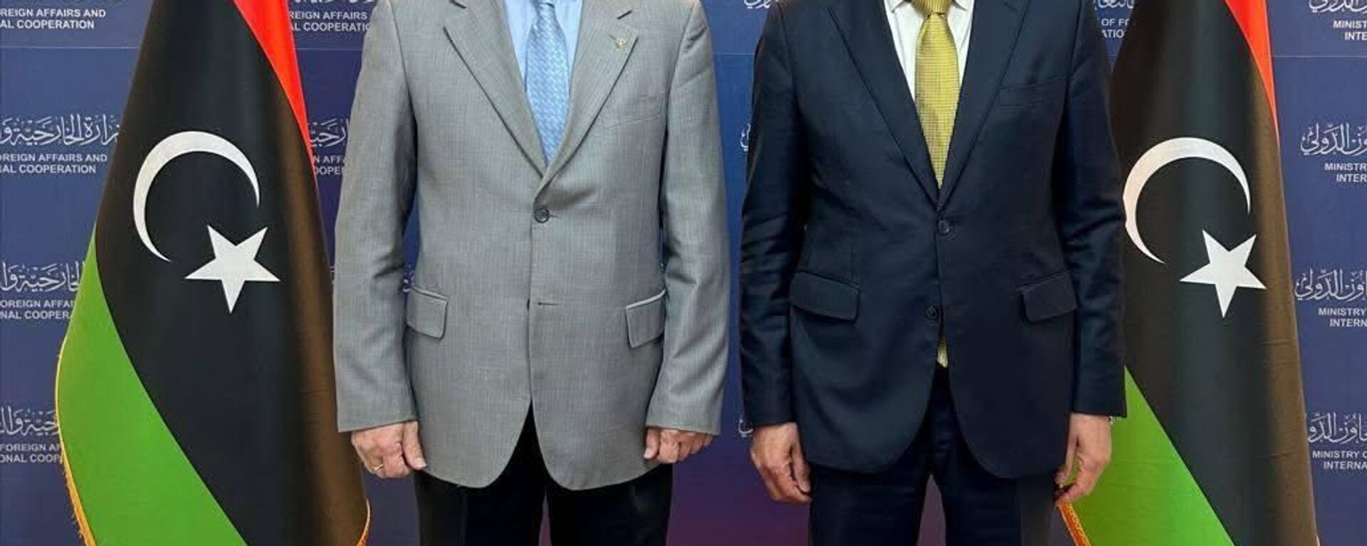 وزير الخارجية المكلف في حكومة الوحدة الوطنية الليبية الطاهر الباعور يستقبل سفير روسيا لدى ليبيا إيدار أغانين مارس 2026 - سبوتنيك عربي, 1920, 26.03.2026