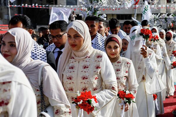 حفل زفاف جماعي لـ50 عريسًا في مدينة غزة، نظمته مؤسسة الإغاثة الإنسانية (IHH) - سبوتنيك عربي