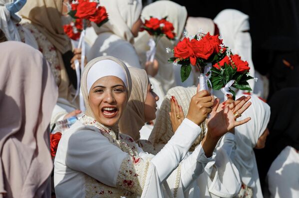 حفل زفاف جماعي لـ50 عريسًا في مدينة غزة، نظمته مؤسسة الإغاثة الإنسانية (IHH) - سبوتنيك عربي