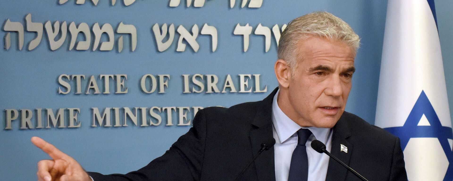 Israeli Prime Minister Yair Lapid speaks about Iran at a security briefing for the foreign press at the Prime Minister's office in Jerusalem, Wednesday, Aug. 24, 2022. Lapid called on U.S. President Joe Biden and Western powers to call off an emerging nuclear deal with Iran, saying an agreement would fail to prevent Iran from developing a nuclear bomb and reward it with billions of dollars to fund Israel's enemies. Israel's caretaker prime minister used stark language on Wednesday in his criticism of the expected agreement. (Debbie Hill/Pool via AP) - سبوتنيك عربي, 1920, 13.05.2026