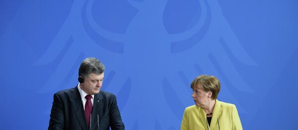 بيوتر بوروشينكو و أنجيلا ميركل - سبوتنيك عربي