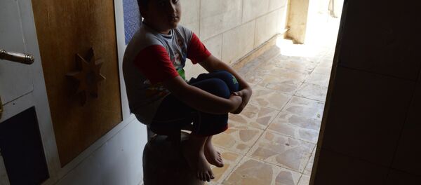 طفل عراقي في حوزة تنظيم داعش لتهيئته ليصبح قنبلة بشرية طفل عراقي في حوزة تنظيم داعش لتهيئته ليصبح قنبلة بشرية - سبوتنيك عربي