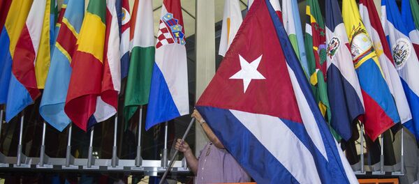 رفع العلم الكوبي على مدخل وزارة الخارجية الأمريكية - سبوتنيك عربي