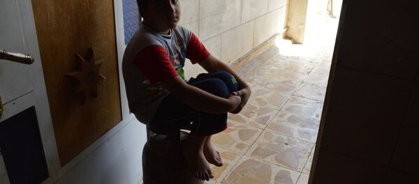 طفل عراقي في مخيم اللجوء - سبوتنيك عربي