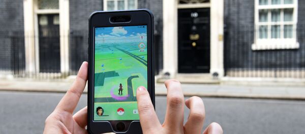 لاعبو لعبة بوكيمون-غو (Pokemon Go) في بريطانيا، 14 يوليو/ تموز 2016. - سبوتنيك عربي