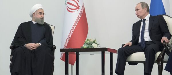 الرئيسين الروسي فلاديمير بوتين والإيراني حسن روحاني (ارشيفية) - سبوتنيك عربي