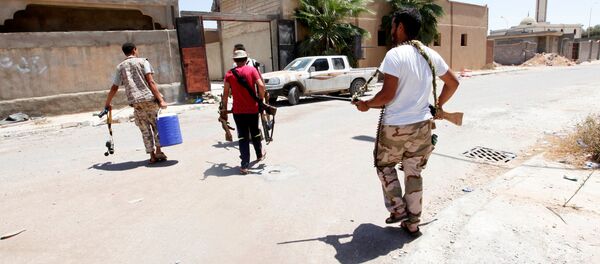 ليبيا - أفراد القوات الليبية خلال تواجدهم في مواقع المواجهة ضد تنظيم داعش في مدينة سرت، 15 أغسطس/ آب 2016 - سبوتنيك عربي