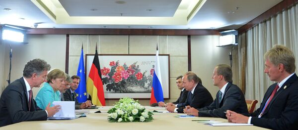 بوتين وميركل بوتين وميركل - سبوتنيك عربي