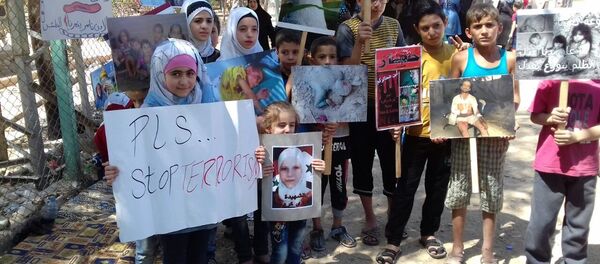 اعتصام من أجل فك الحصار عن بلدتي الفوعة وكفريا وإنقاذ المدنيين فيهما - سبوتنيك عربي