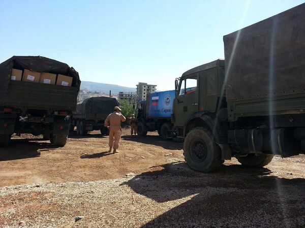 مساعدات انسانية روسية سورية مشتركة في ريف حمص الغربي  - سبوتنيك عربي