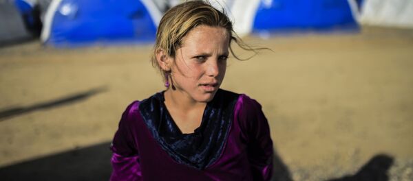 اللاجئون العراقيون من بلدة القيارة جنوبي الموصل إبان إنطلاق عملية تحرير الموصل من تنظيم داعش، 22 أكتوبر/ تشرين الأول 2016 - سبوتنيك عربي