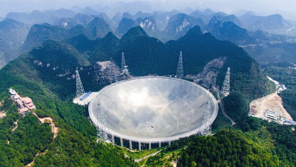 In this Saturday, Sept. 24, 2016 photo released by Xinhua News Agency, an aerial view shows the Five-hundred-meter Aperture Spherical Telescope (FAST) in the remote Pingtang county in southwest China's Guizhou province - سبوتنيك عربي