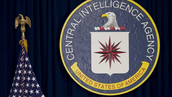 The CIA seal is seen displayed before President Barack Obama speaks at the CIA Headquarters in Langley, Va., Wednesday, April 13, 2016 - سبوتنيك عربي