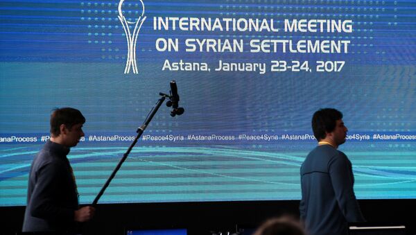 Reporters walk in the media center set for Syria peace talks, in Astana, Kazakhstan, January 23, 2017. - سبوتنيك عربي