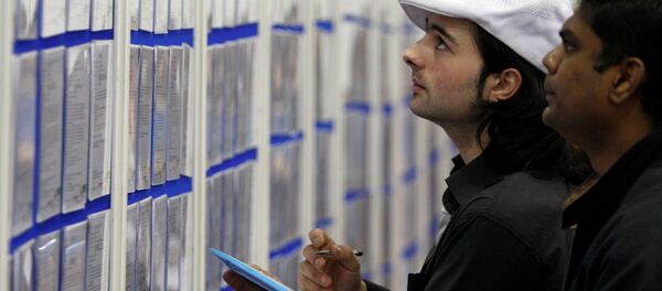 People look at job listings at the Careers and Jobs Live careers fair at the ExCeL centre in London (File) People look at job listings at the Careers and Jobs Live careers fair at the ExCeL centre in London (File) - سبوتنيك عربي