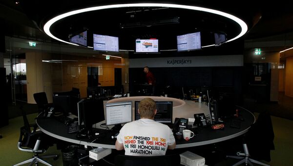 FILE PHOTO: An employee works near screens in the virus lab at the headquarters of Russian cyber security company Kaspersky Labs in Moscow July 29, 2013.  - سبوتنيك عربي