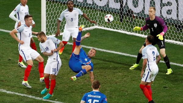 Football Soccer - England v Iceland - EURO 2016 - Round of 16 - Stade de Nice, Nice, France - 27/6/16Iceland's Ragnar Sigurdsson attempts an overhead kick - سبوتنيك عربي