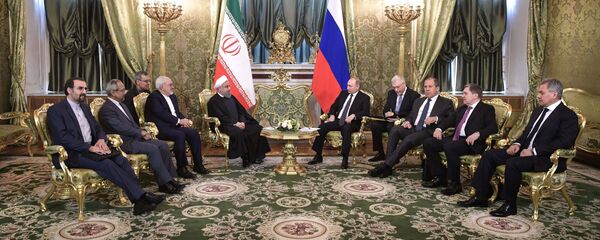 الرئيس الروسي فلاديمير بوتين مع نظيره الإيراني حسن روحاني - سبوتنيك عربي