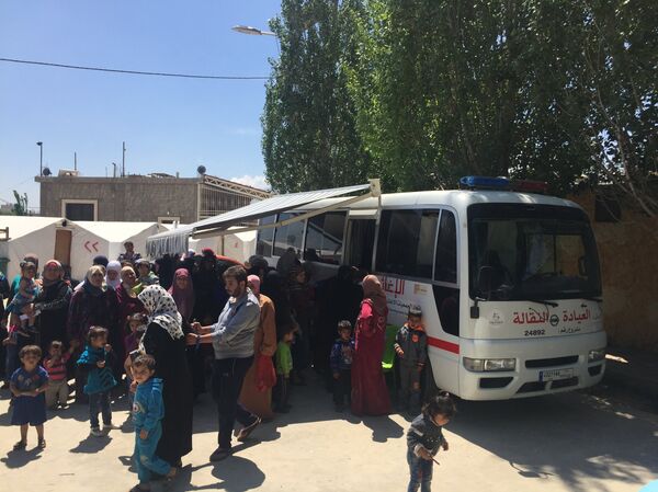 عيادة نقالة - مخيم تعلبايا - سبوتنيك عربي