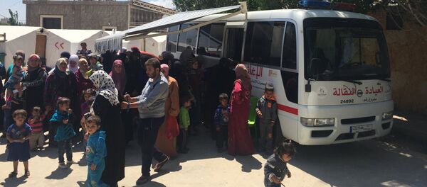 عيادة نقالة - مخيم تعلبايا - سبوتنيك عربي